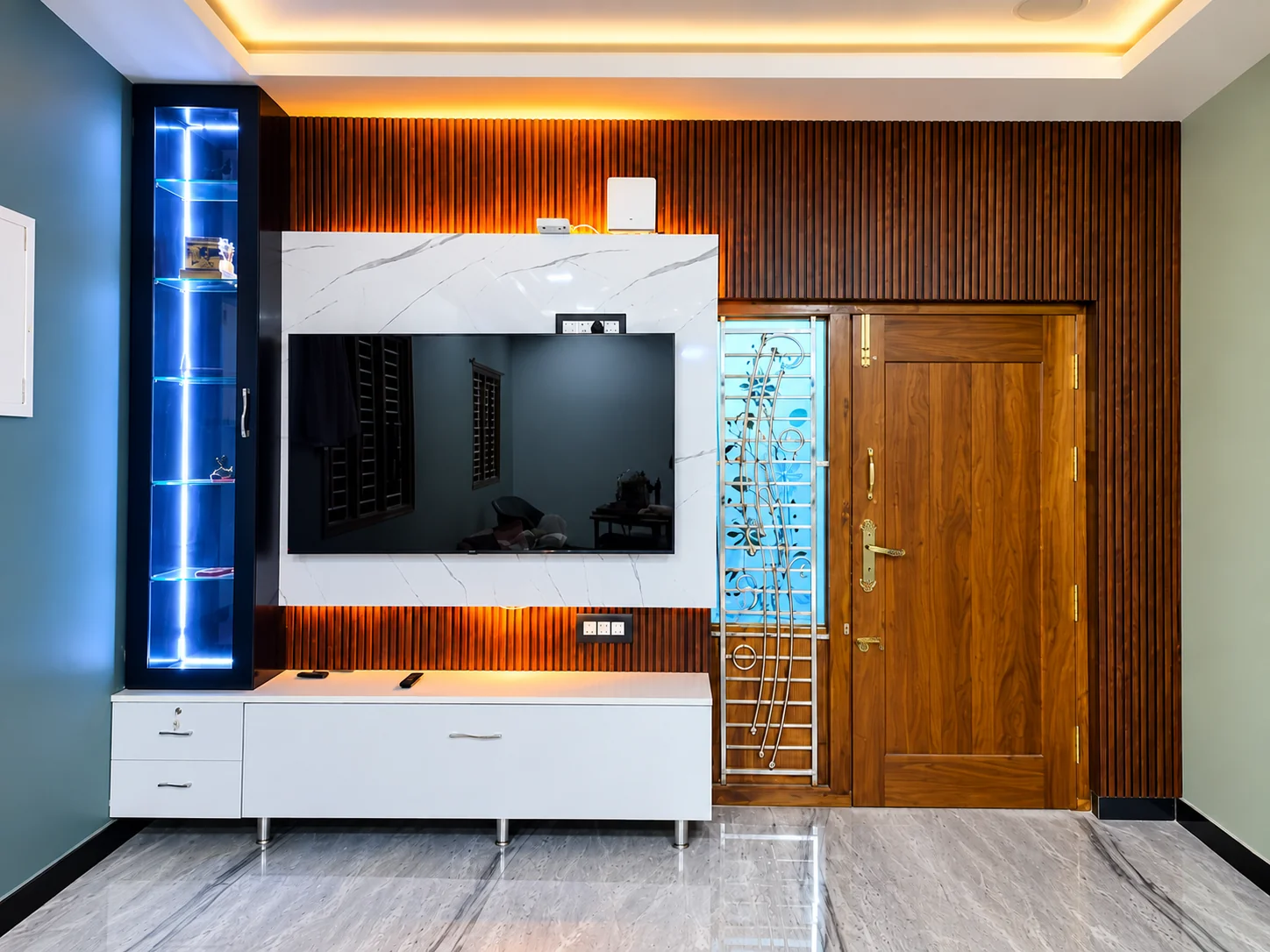 Modern living room TV feature wall with warm lighting